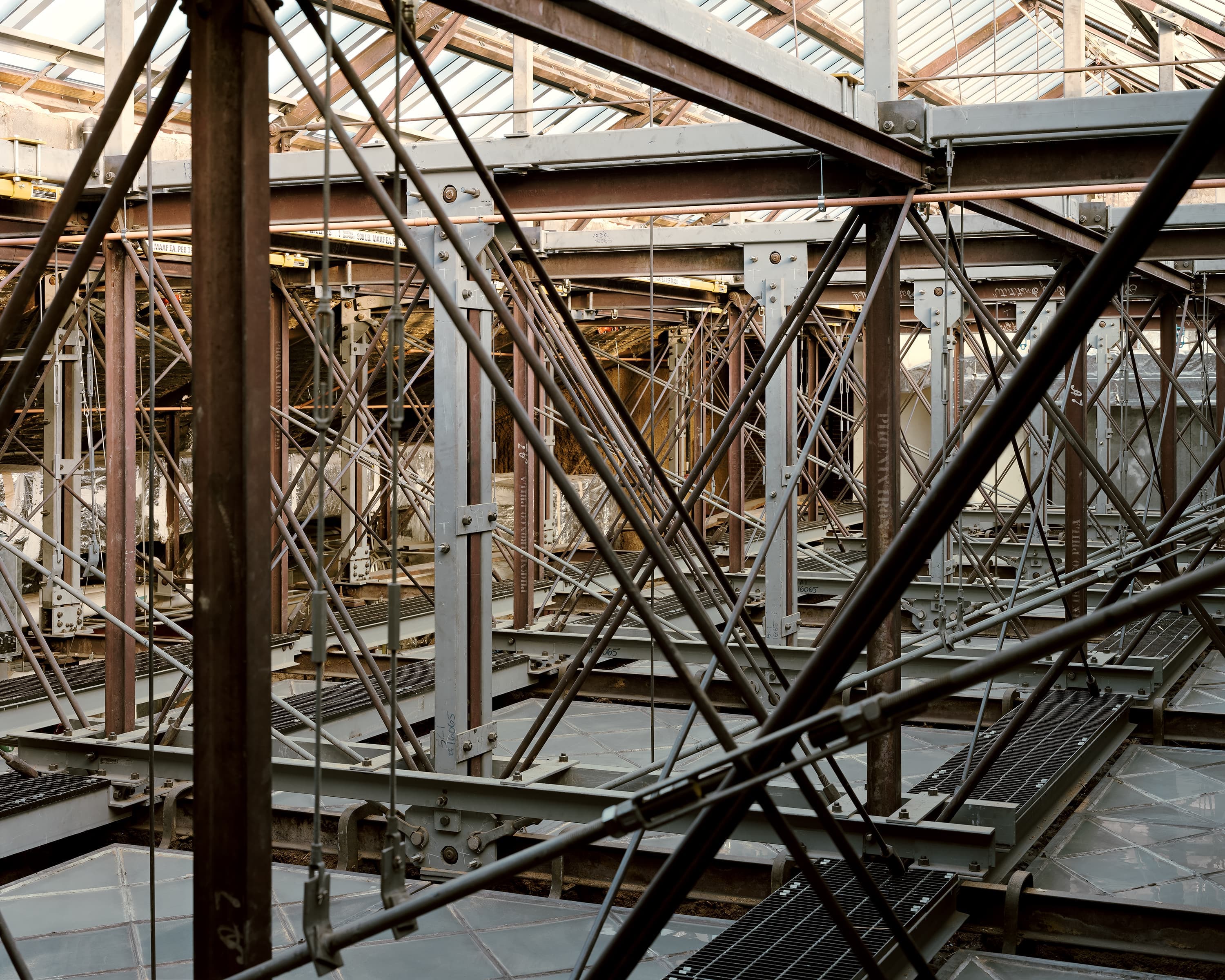 Diagonal view of cabling and i-beams layout within the skylight system designed by Ziger|Snead Architects.