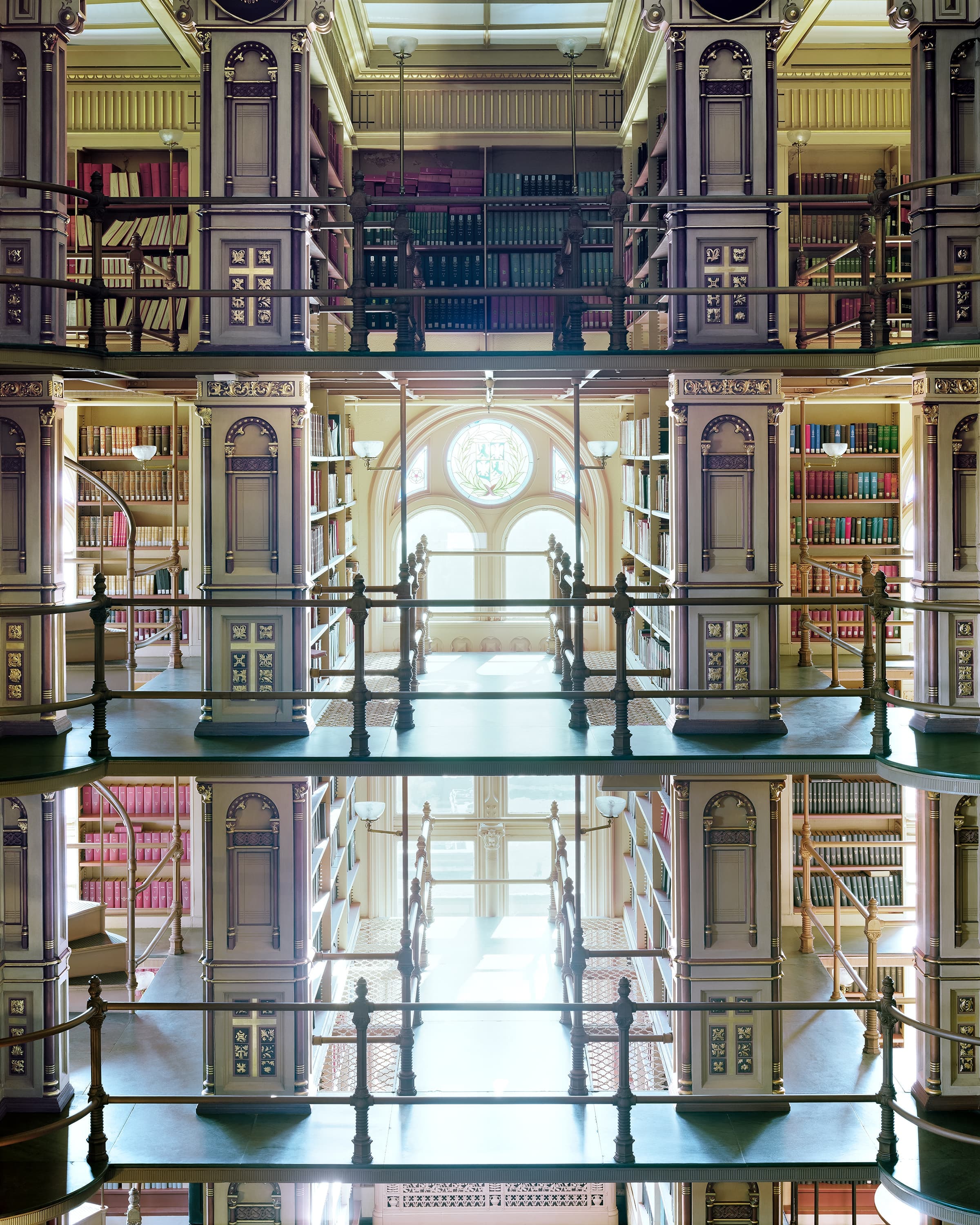 Historic Georgetown library, facing arched window with stained glass.