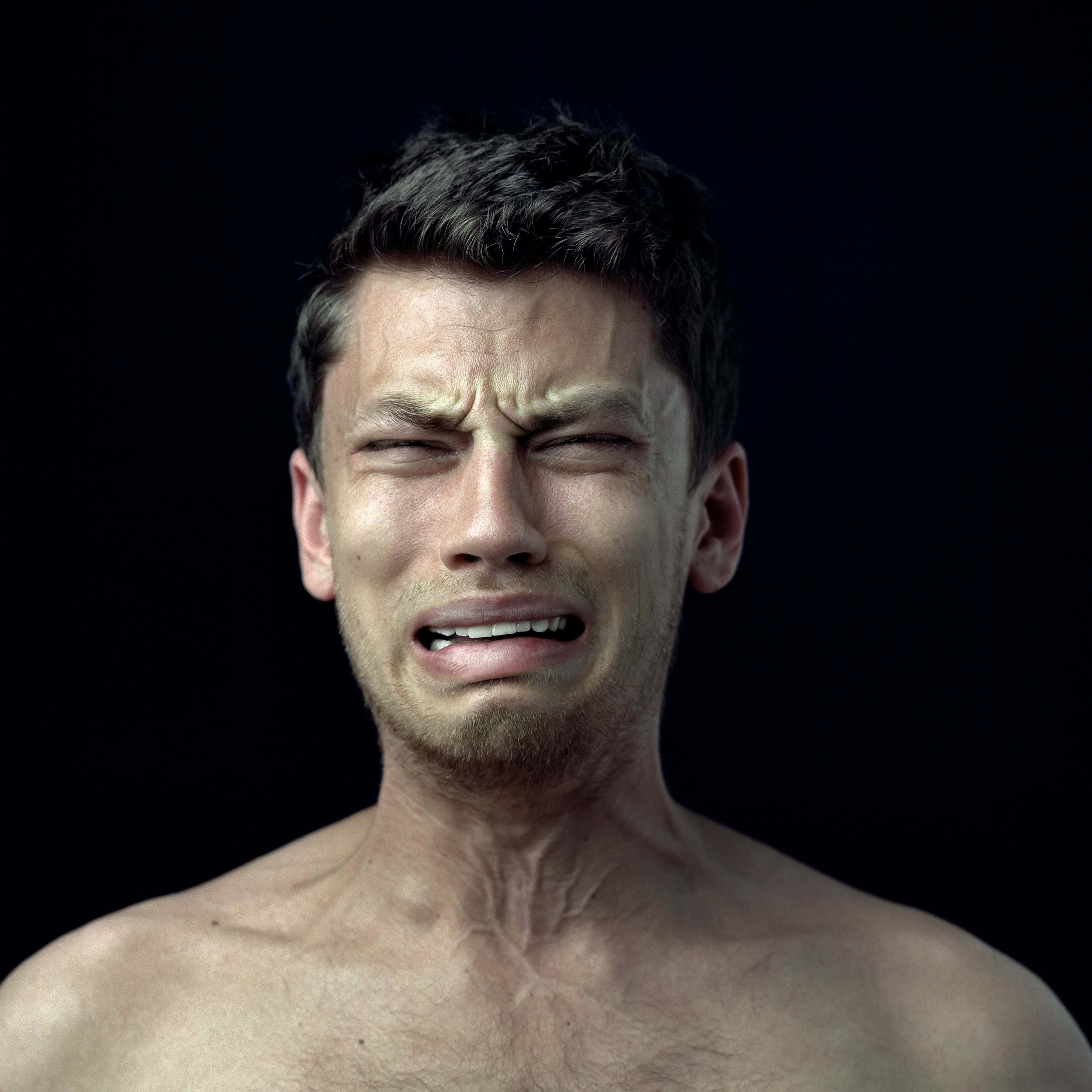 Portrait of a man expressing weeping.