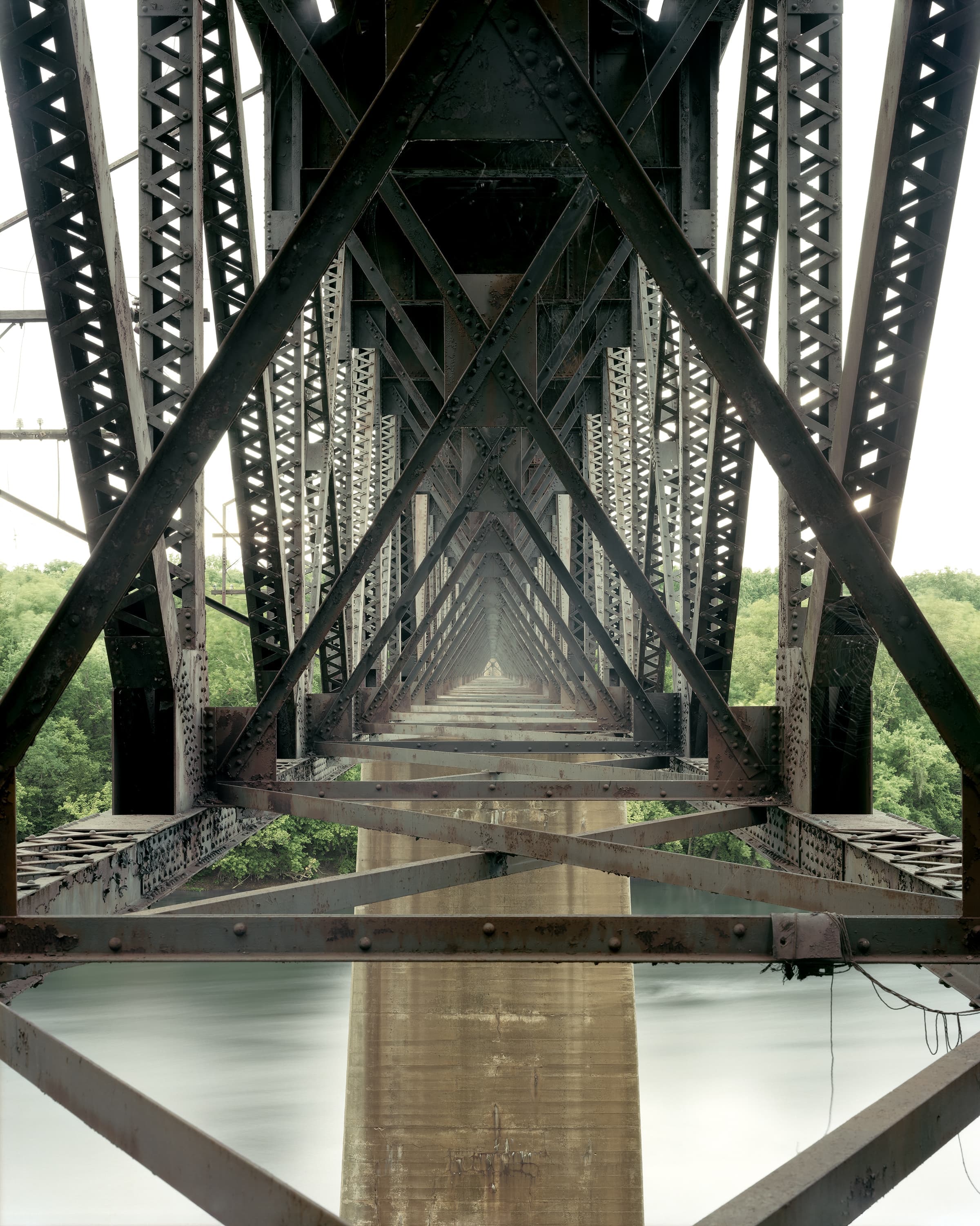 Under the deck of a deck truss bridge for Norfolk Southern Railway crossing the Potomac River.